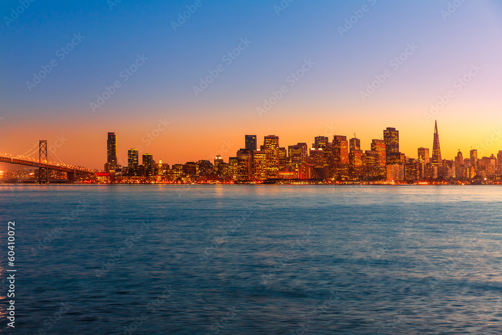 San Francisco sunset skyline California bay water reflection San Francisco sunset skyline California bay water reflection