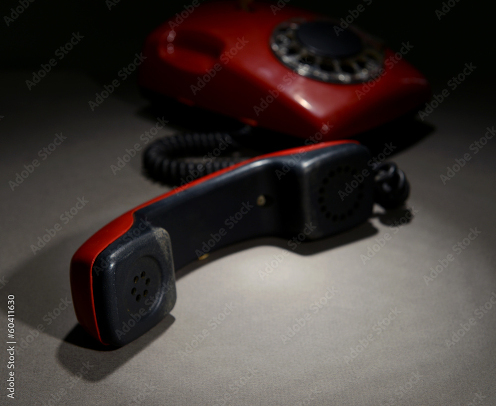 Red retro telephone on dark color background Red retro telephone on dark color background