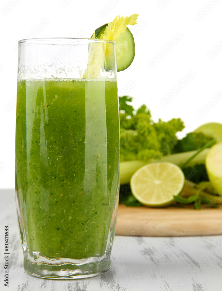 Fototapeta premium Glass of green vegetable juice and vegetables
