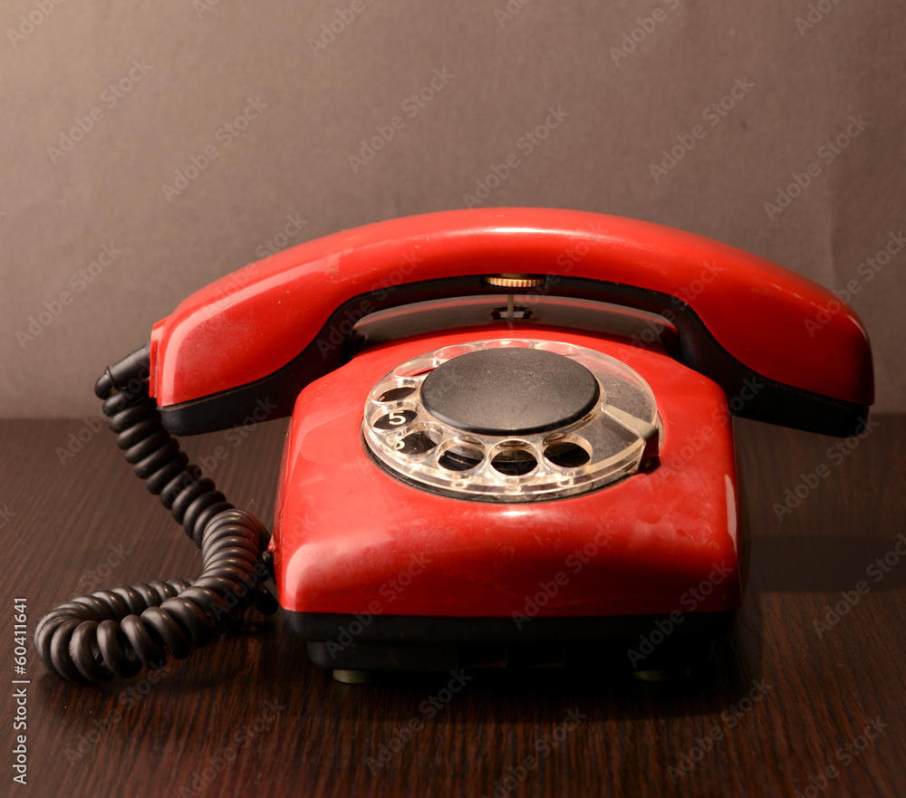 Red retro telephone,on dark background Red retro telephone,on dark background