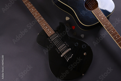 Obraz na plátne Electric and acoustic guitars on dark background
