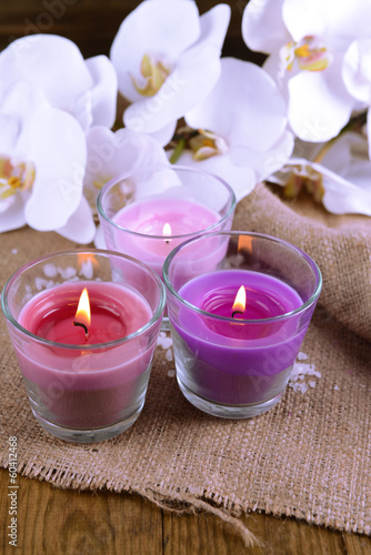 Composition with beautiful colorful candles, sea salt and