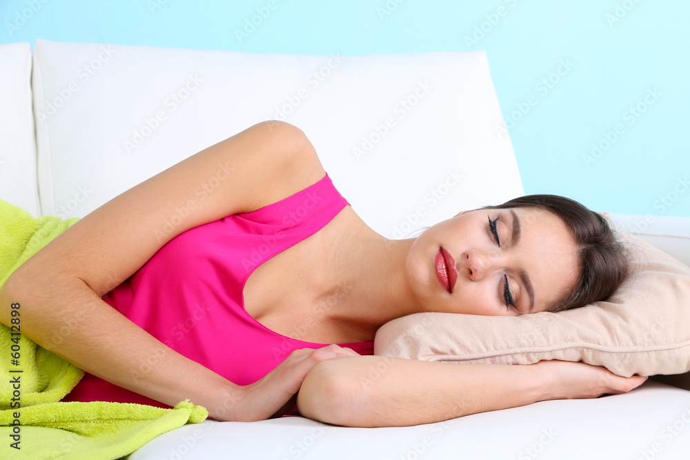 Beautiful young woman sleeping on sofa close up Beautiful young woman sleeping on sofa close up
