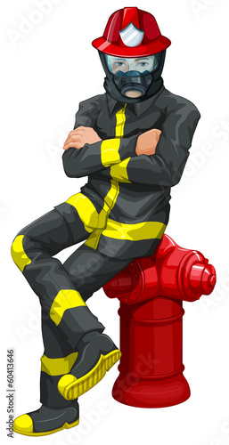 A fireman sitting above the hydrant