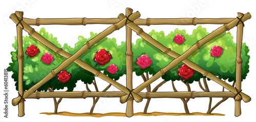 A bamboo fence with flowering plants