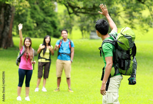 young man with friends camping in the park © Odua Images