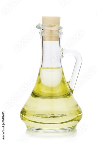 Salad dressing vinegar oil in a glass pouring jug with cork
