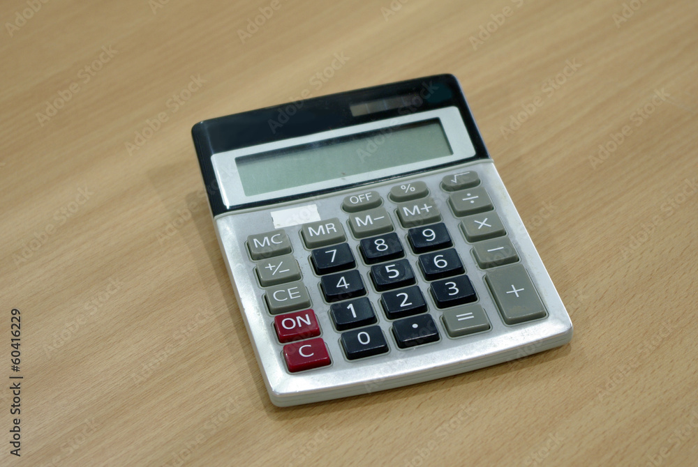 calculator on wood table calculator on wood table