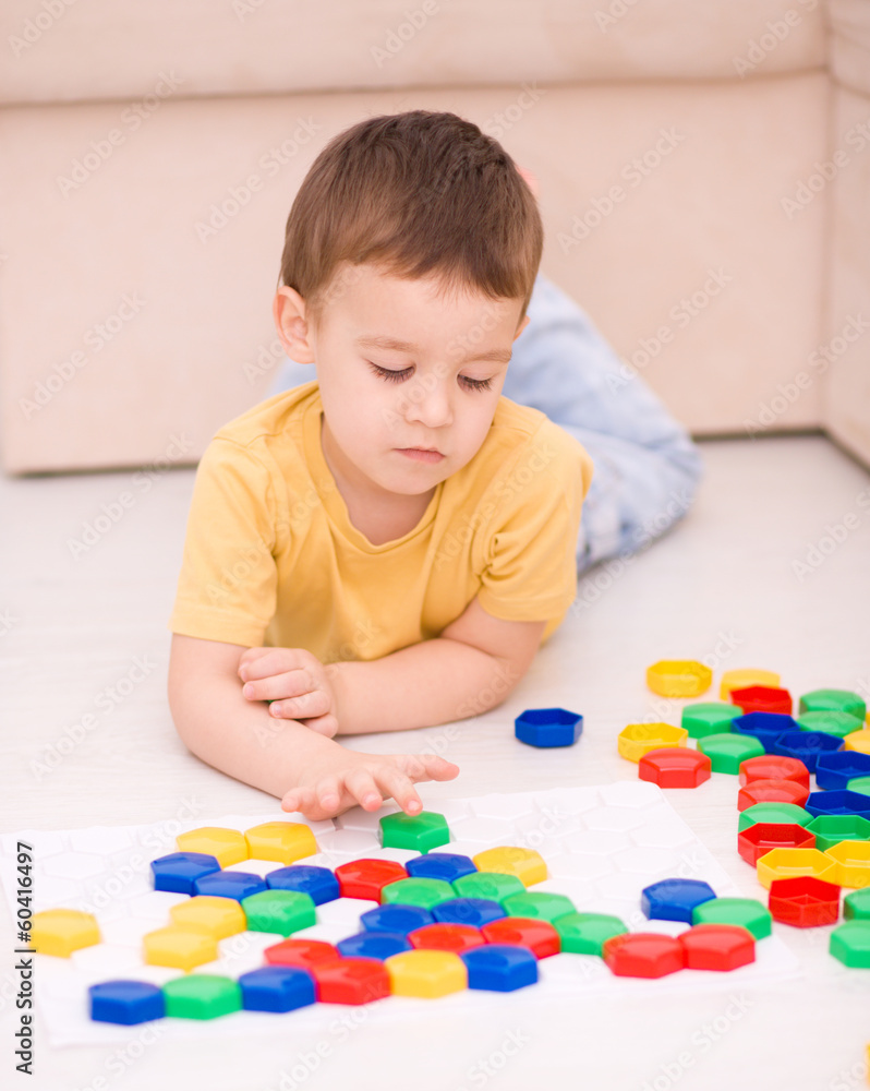 Boy is playing with building blocks Boy is playing with building blocks