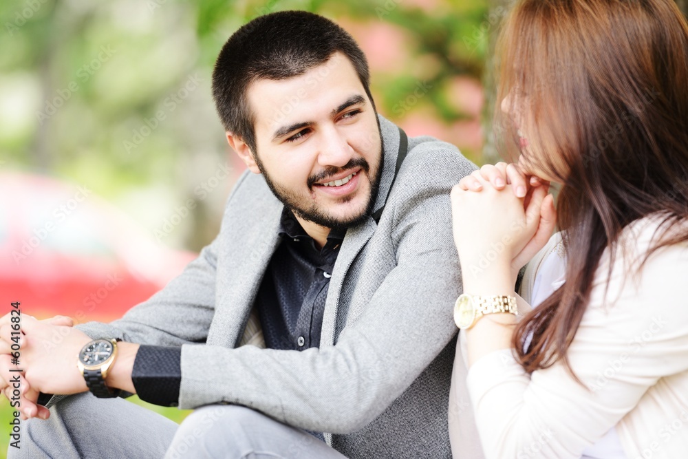 Fototapeta premium Lovely couple enjoying fall in love at park