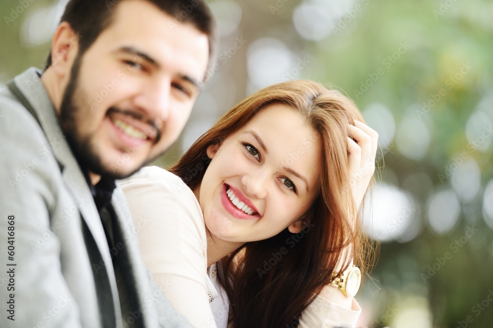 Lovely couple enjoying fall in love at park Lovely couple enjoying fall in love at park
