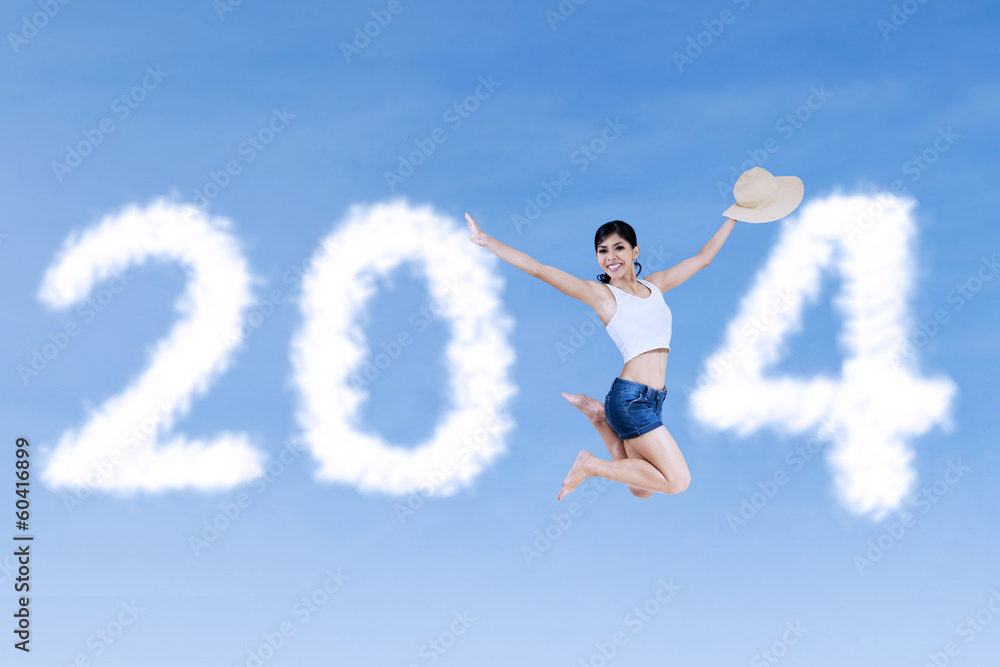 Excited girl jumping announce Happy New year 2014