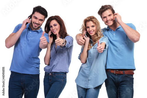 group of people making the ok sign on the phone