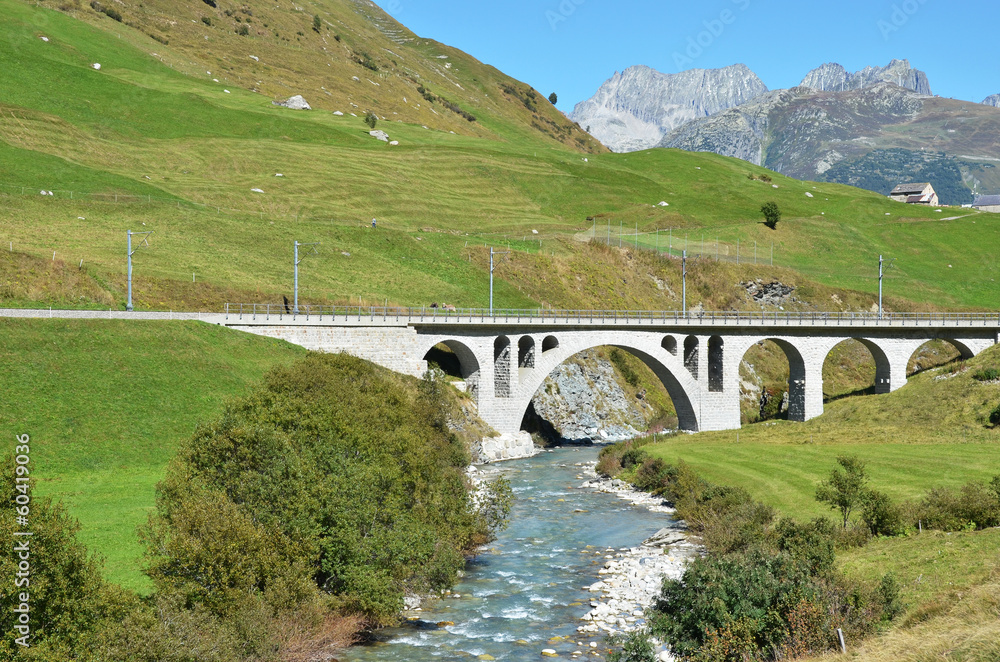 Bridge over mountain river. Furka pass, Switzerland Bridge over mountain river. Furka pass, Switzerland