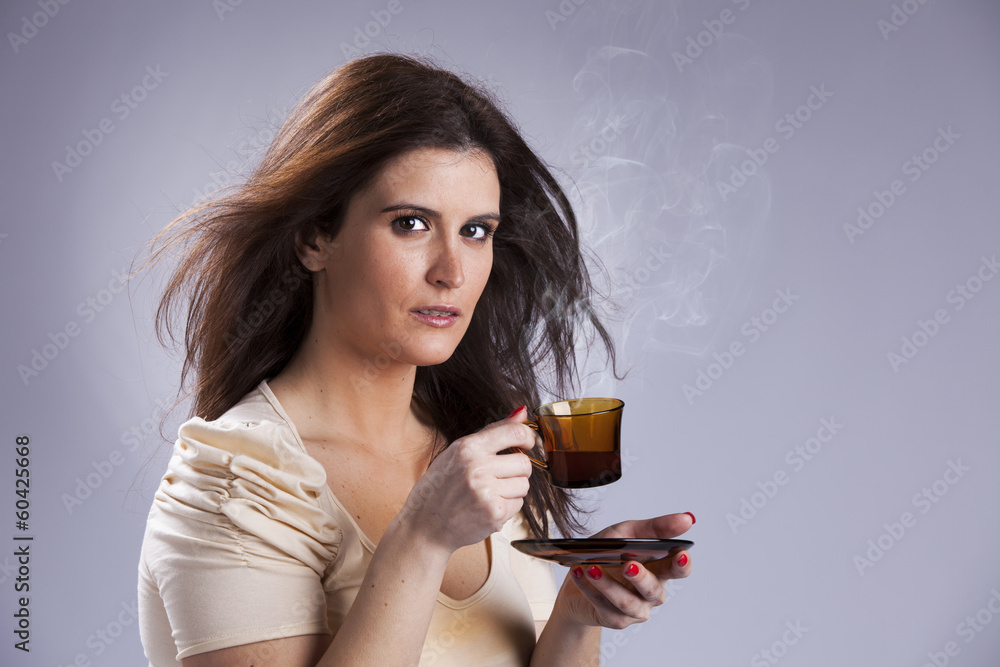 Woman drinking a hot drink Woman drinking a hot drink