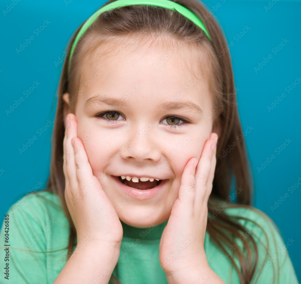 Little girl is holding her face Little girl is holding her face