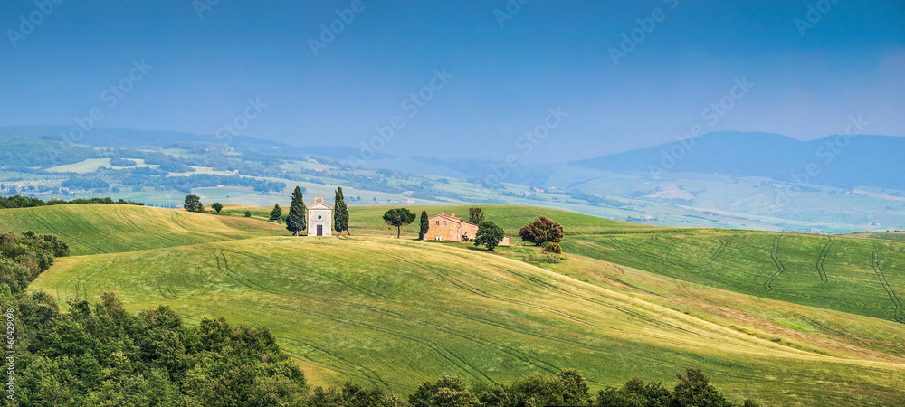 Tuscany landscape panorama with chapel and old farm house, Italy