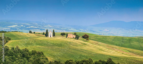 Tuscany landscape panorama with chapel and old farm house, Italy