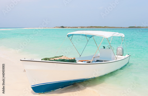 White boat at the beach of archipelago Los Roques, Venezuela