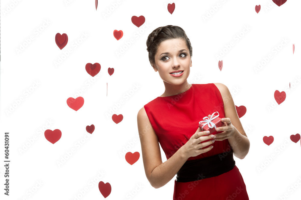 caucasian woman in red dress holding gift caucasian woman in red dress holding gift