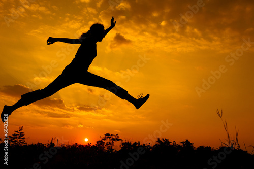 Wallpaper Mural woman  jumping on the nature of the evening Torontodigital.ca