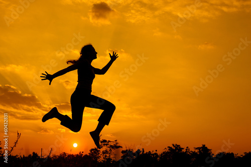 woman jumping on the nature of the evening
