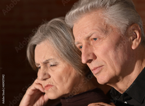 Sad elder couple