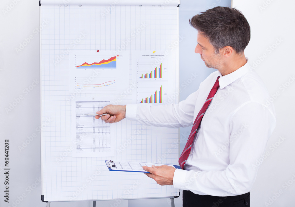 Businessman Analyzing Graph Businessman Analyzing Graph
