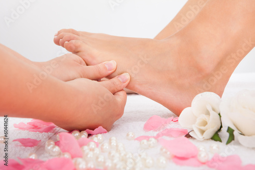 Woman's Feet Receiving Foot Massage © Andrey Popov