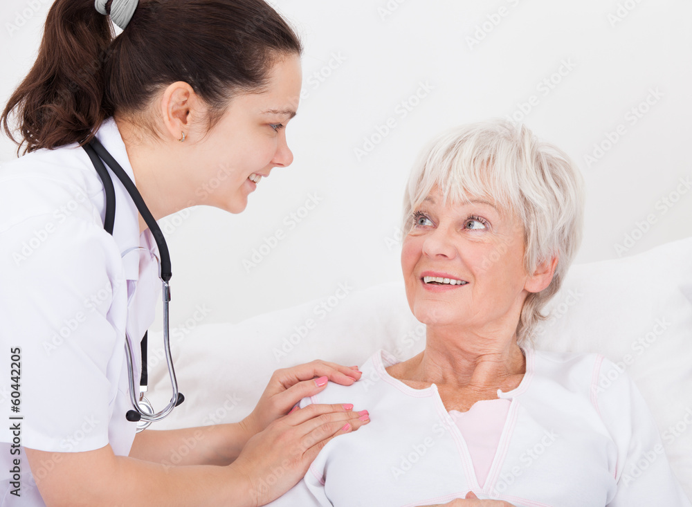 Happy Doctor And Patient Looking At Each Other Happy Doctor And Patient Looking At Each Other