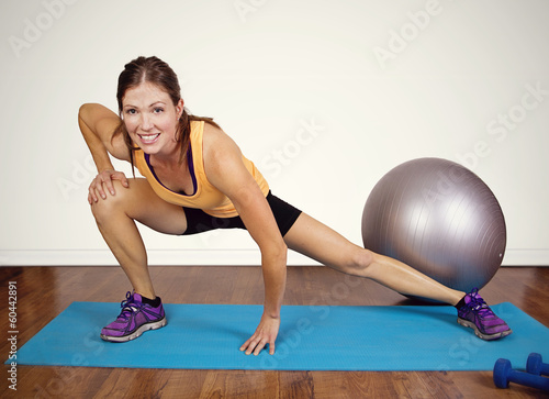 Fit woman stretching before a workout