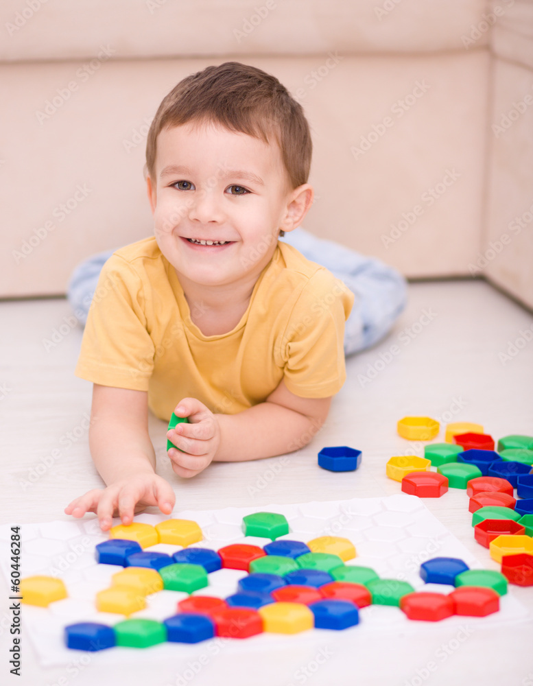 Boy is playing with building blocks Boy is playing with building blocks
