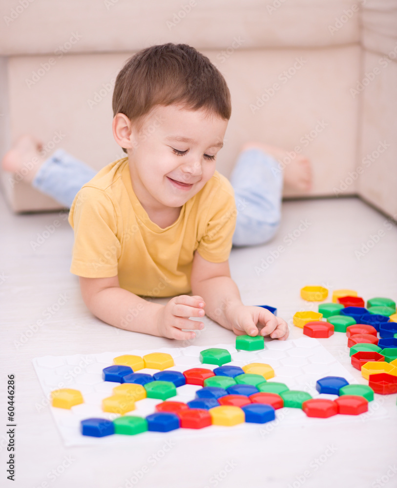 Boy is playing with building blocks Boy is playing with building blocks