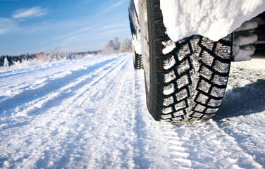 Closeup of car tires in winter morning