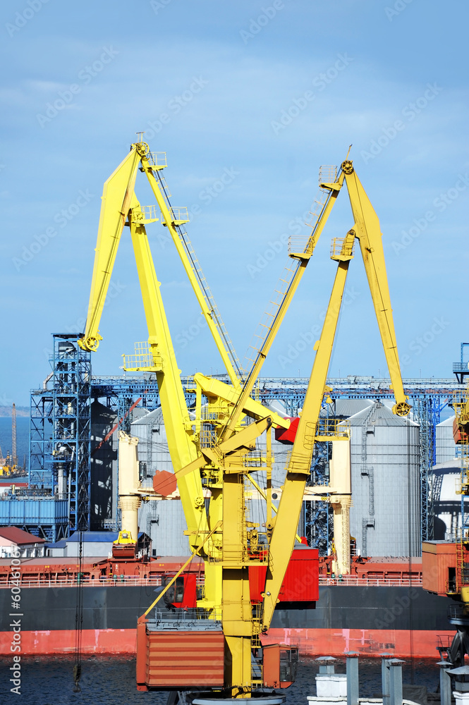 Bulk cargo ship under port crane bridge, Odessa, Ukraine Bulk cargo ship under port crane bridge, Odessa, Ukraine
