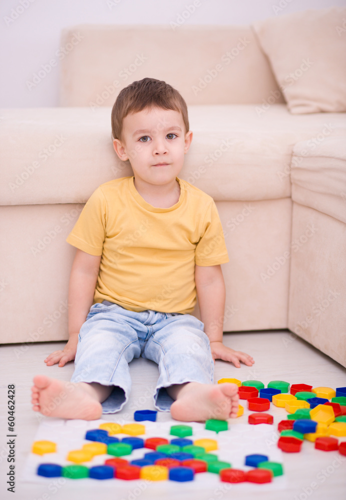 Boy is playing with building blocks Boy is playing with building blocks