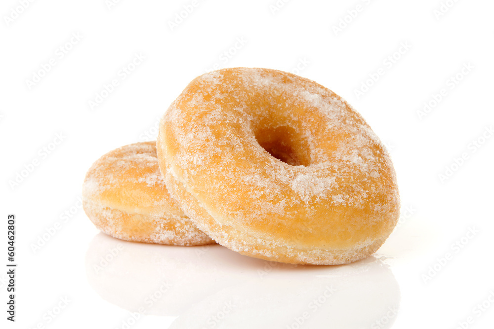 Two stacked sugared donuts over white background Two stacked sugared donuts over white background