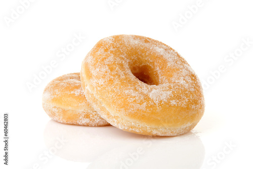 Fotografie, Obraz Two stacked sugared donuts over white background