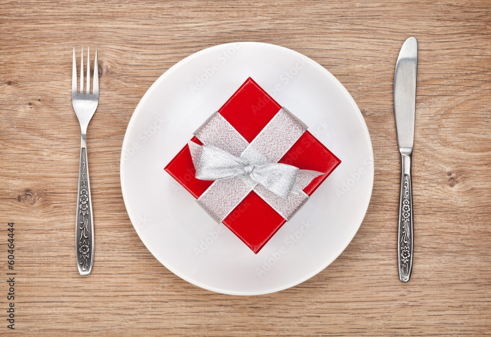 Valentine's day gift box on plate and silverware Valentine's day gift box on plate and silverware