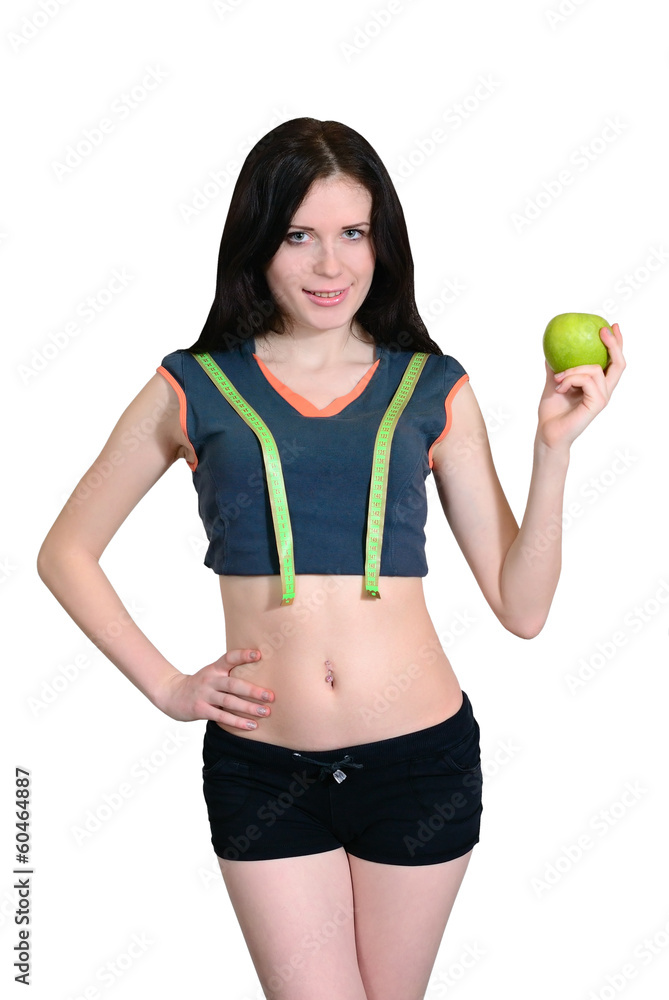 Athletic girl with measuring tape and apple. isolation Athletic girl with measuring tape and apple. isolation