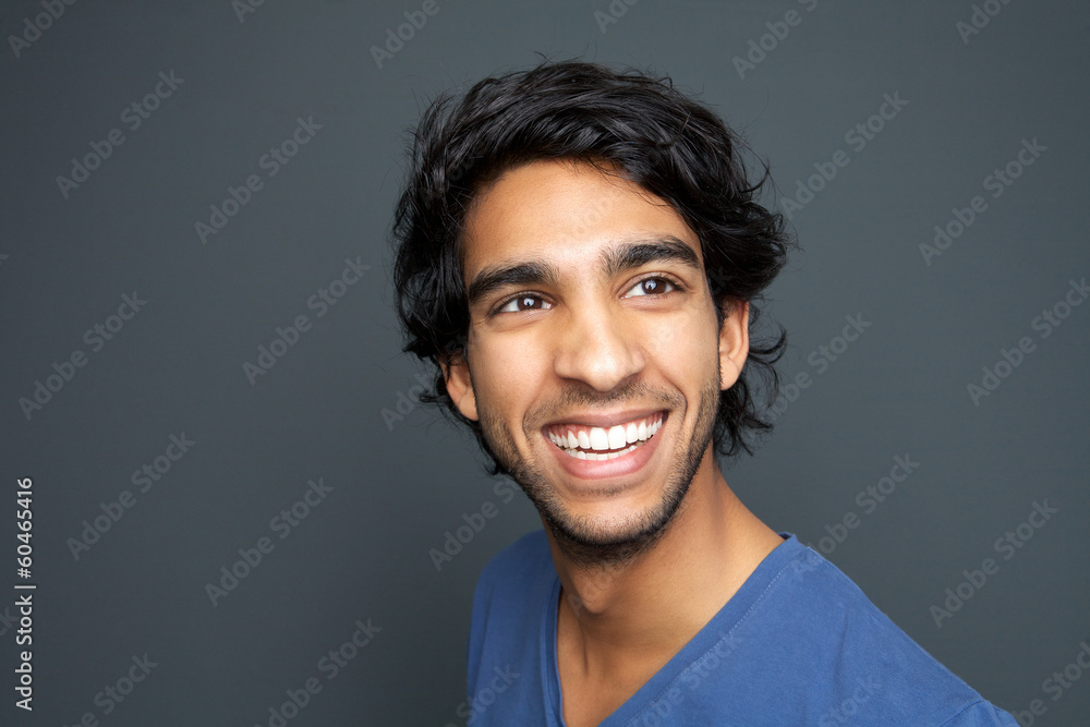 Close up portrait of a happy young man smiling Close up portrait of a happy young man smiling