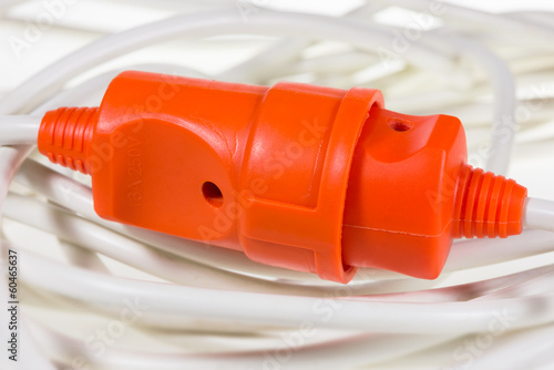 electric plug and socket red color on white wires