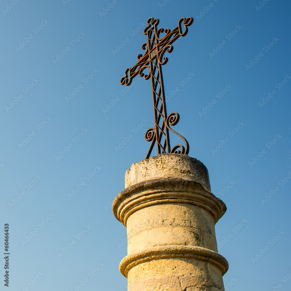 Fototapeta premium iron cross on stone base