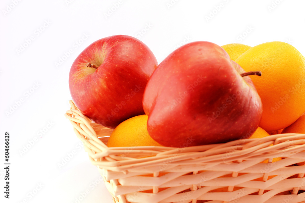 Apples and oranges in a basket