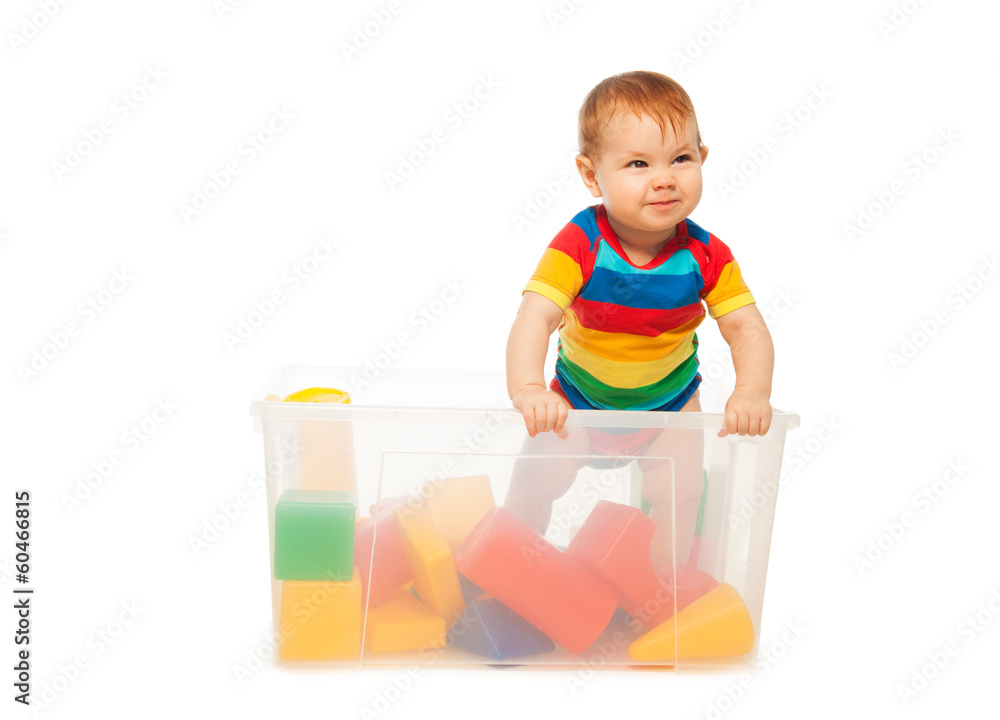 Toddler play in basket with blocks