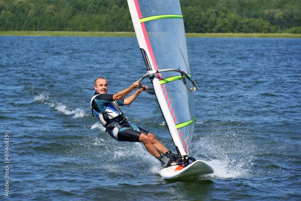 Naklejka premium Windsurfing on the lake Niesłysz, Poland