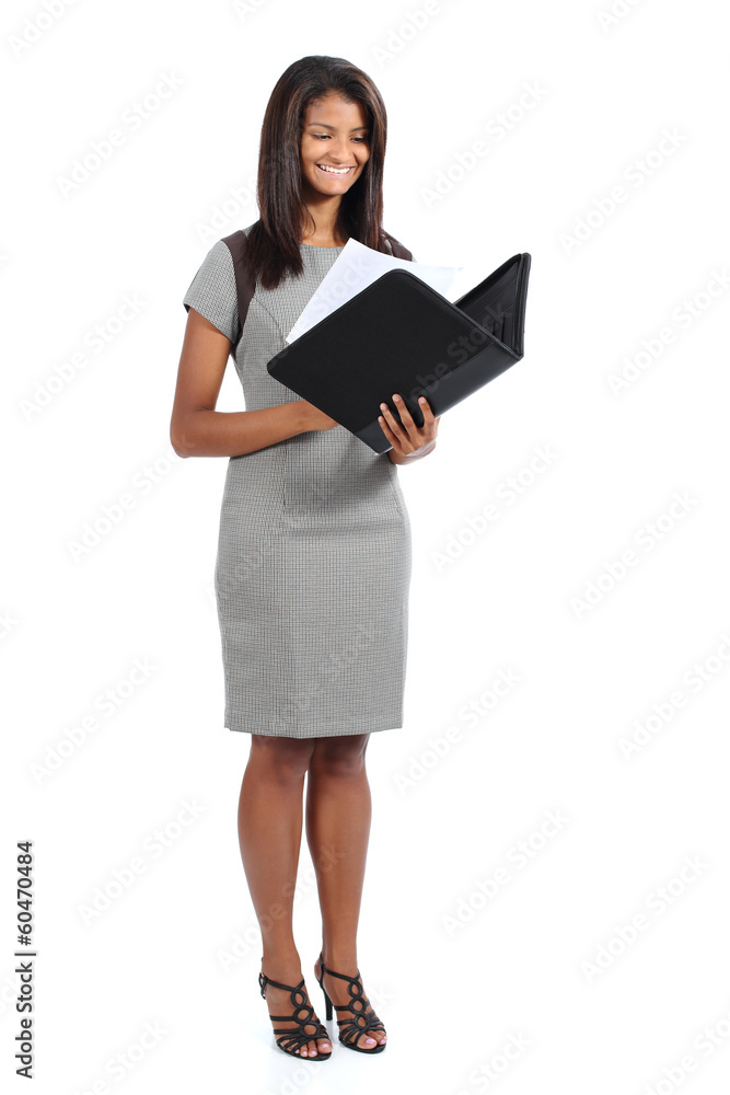 Standing african american businesswoman reading a report Standing african american businesswoman reading a report