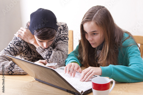 happy young people with computer at home photo