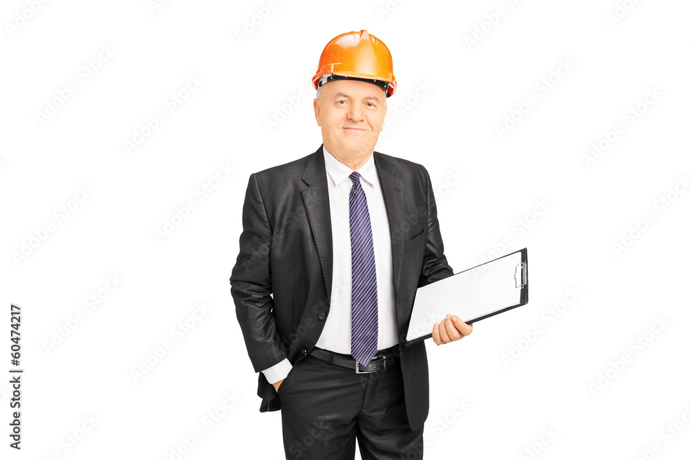 Mature construction worker holding clipboard Mature construction worker holding clipboard