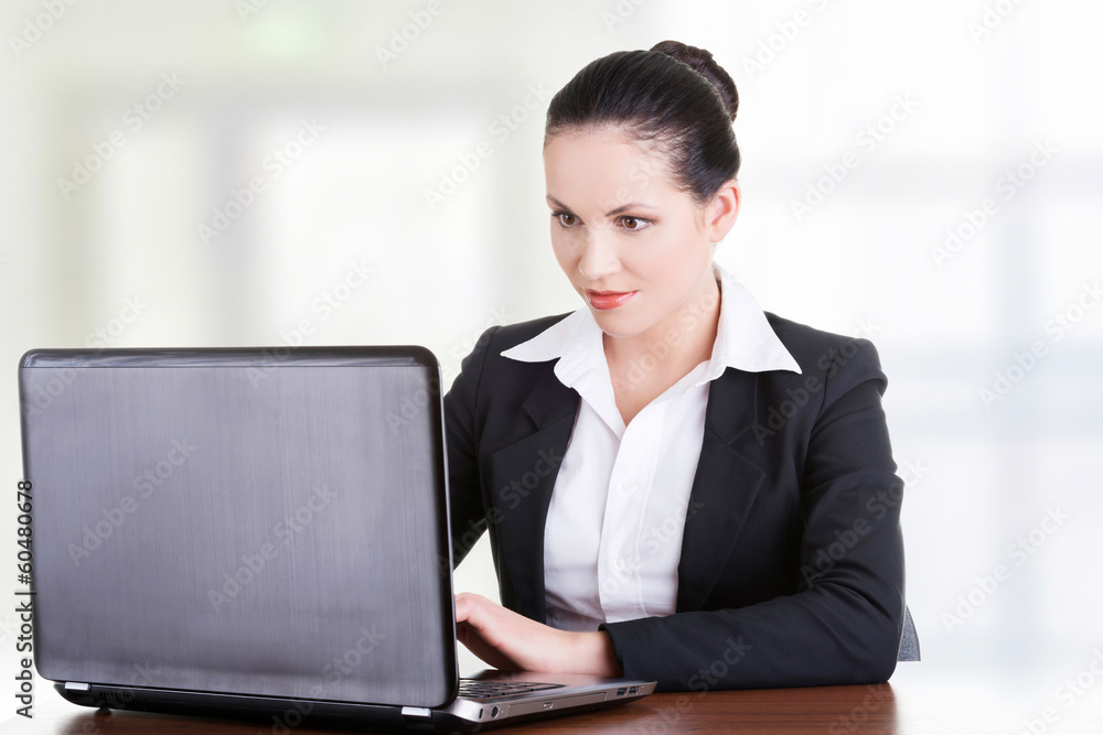 Businesswoman working on laptop computer Businesswoman working on laptop computer